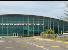 Music producer booked for murder after being held at airport