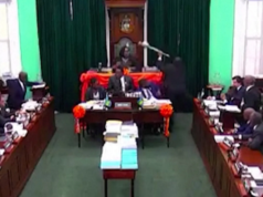 Bahamian politician throws Mace out window